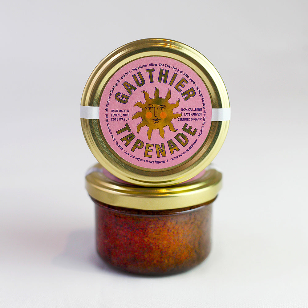 Two jars of Gauthier Tapenade with gold lids on a light gray background